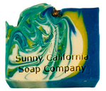 Soap bar swirled in blue, yellow and white with dried chamomile flowers on top. 